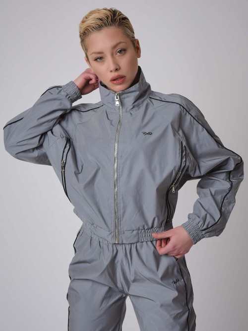 Oversized elasticated jacket with reflective stand-up collar and piping