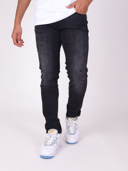 Schmal geschnittene Jeans mit Kratzeffekt - Schwarz