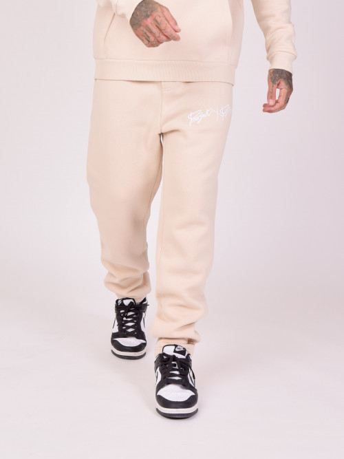 Pantaloni da jogging basic con ricamo integrale del logo - Beige