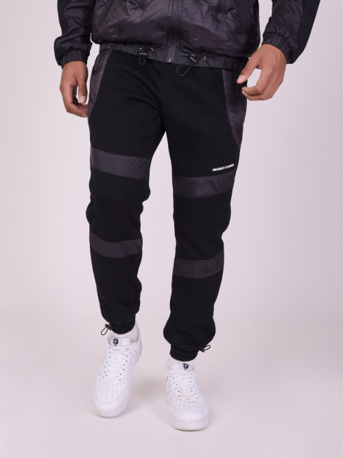 Pantaloni da jogging in due materiali con trapuntatura rotonda - Nero