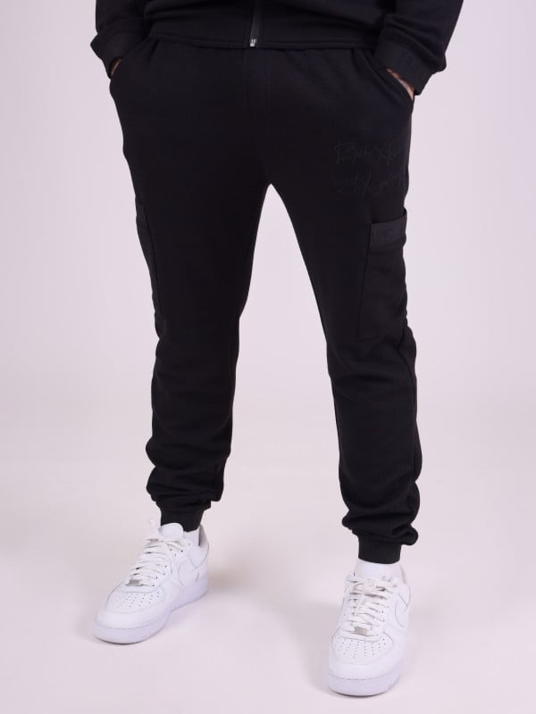 Bas de jogging en tissus texturé et details élastique sport