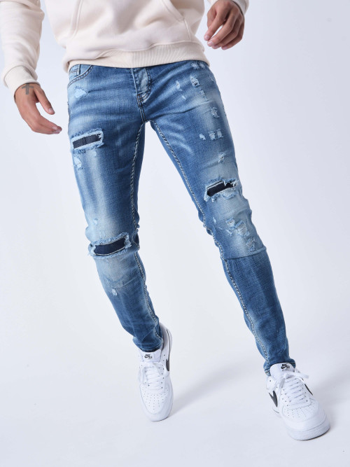 Jeans pitillo desteñidos con agujeros y forro - Azul