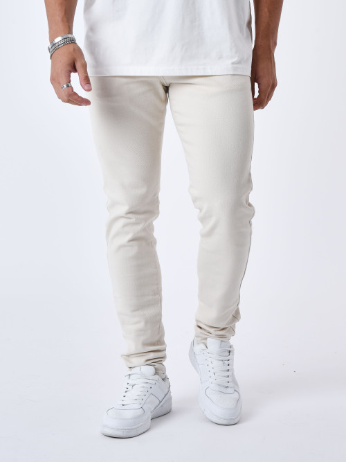 Jeans slim con costuras de contraste - Marfil