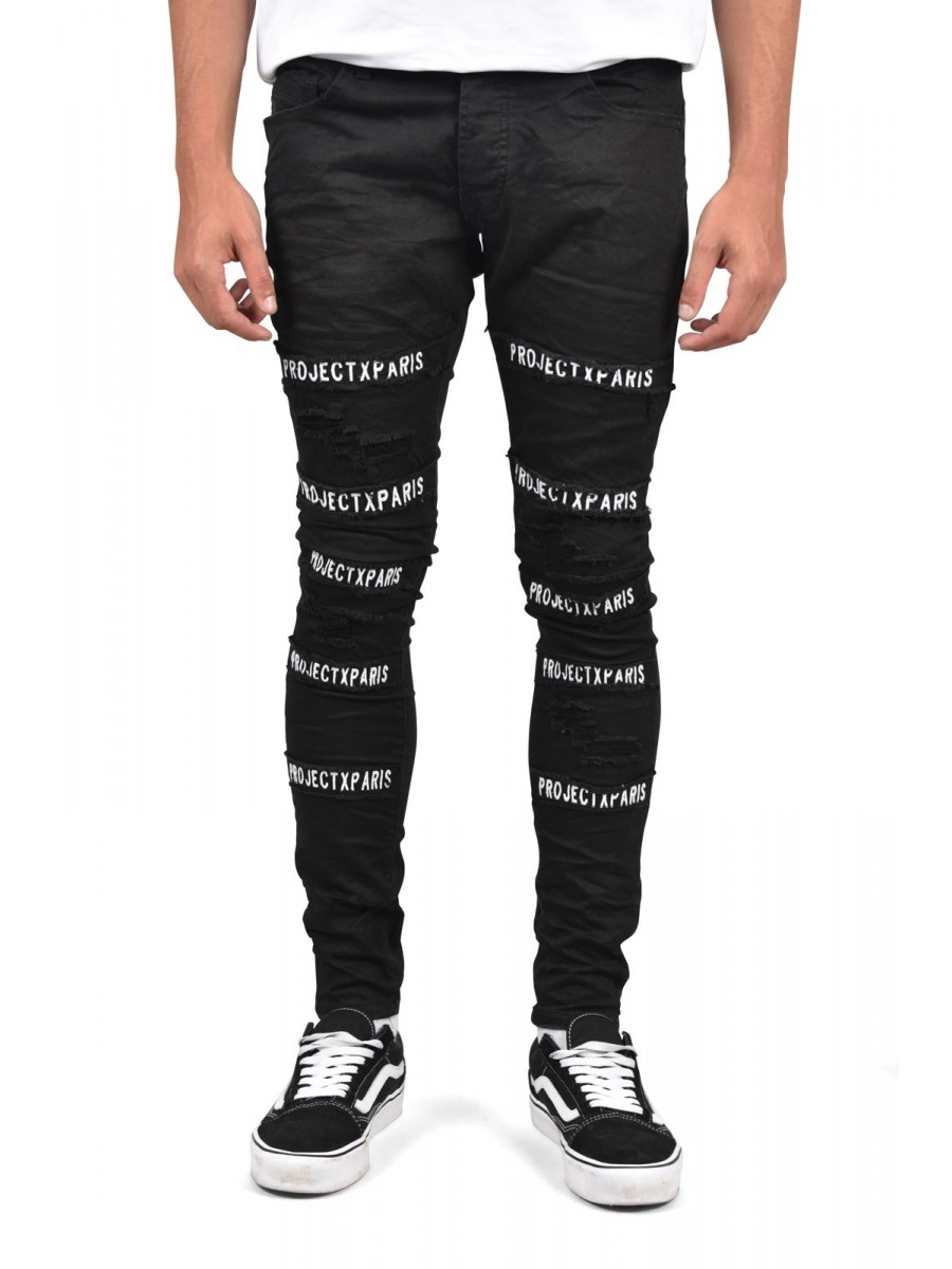 Black skinny jeans with patches