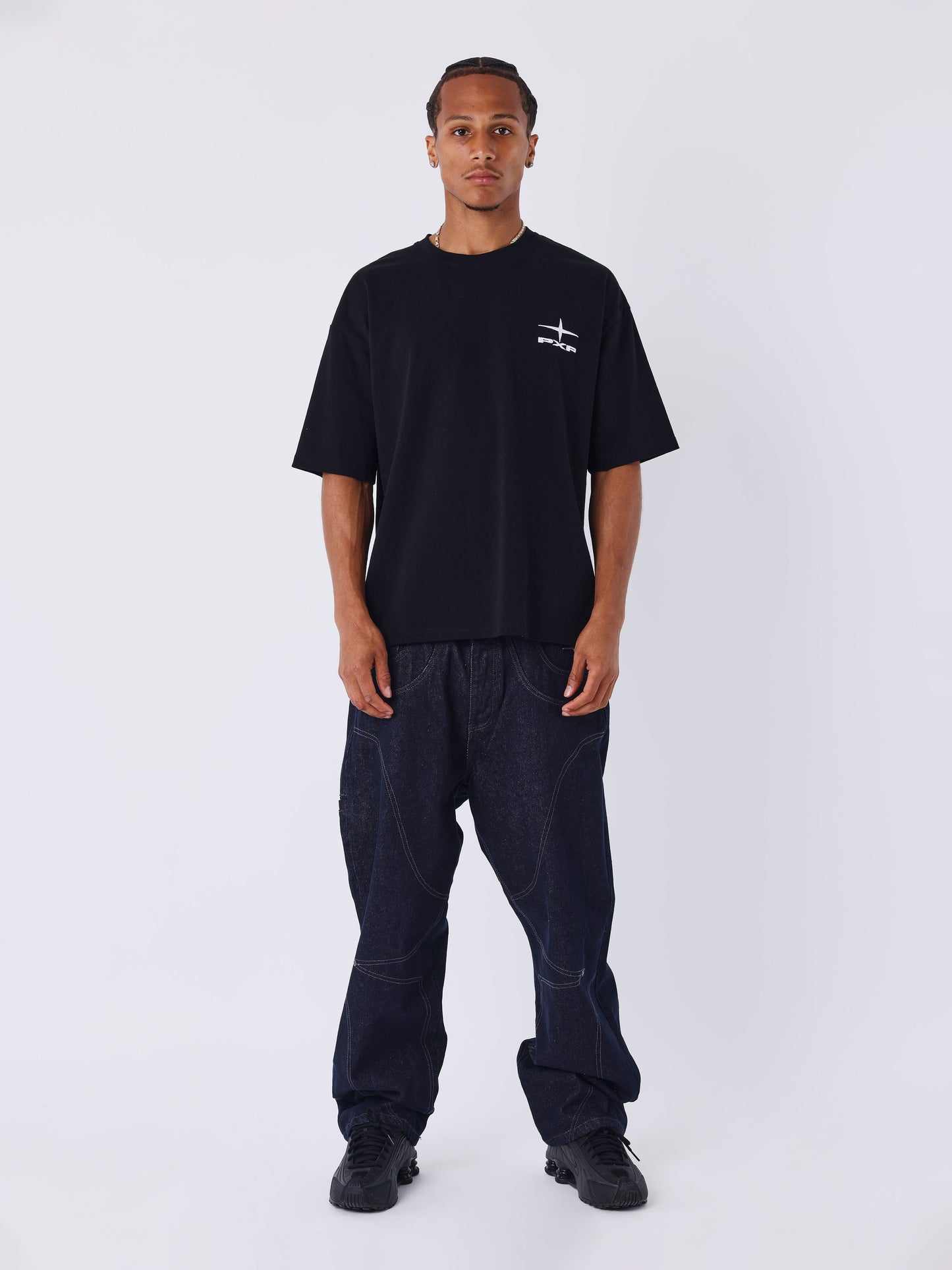 Jeans loose em denim cru com costuras Polaris