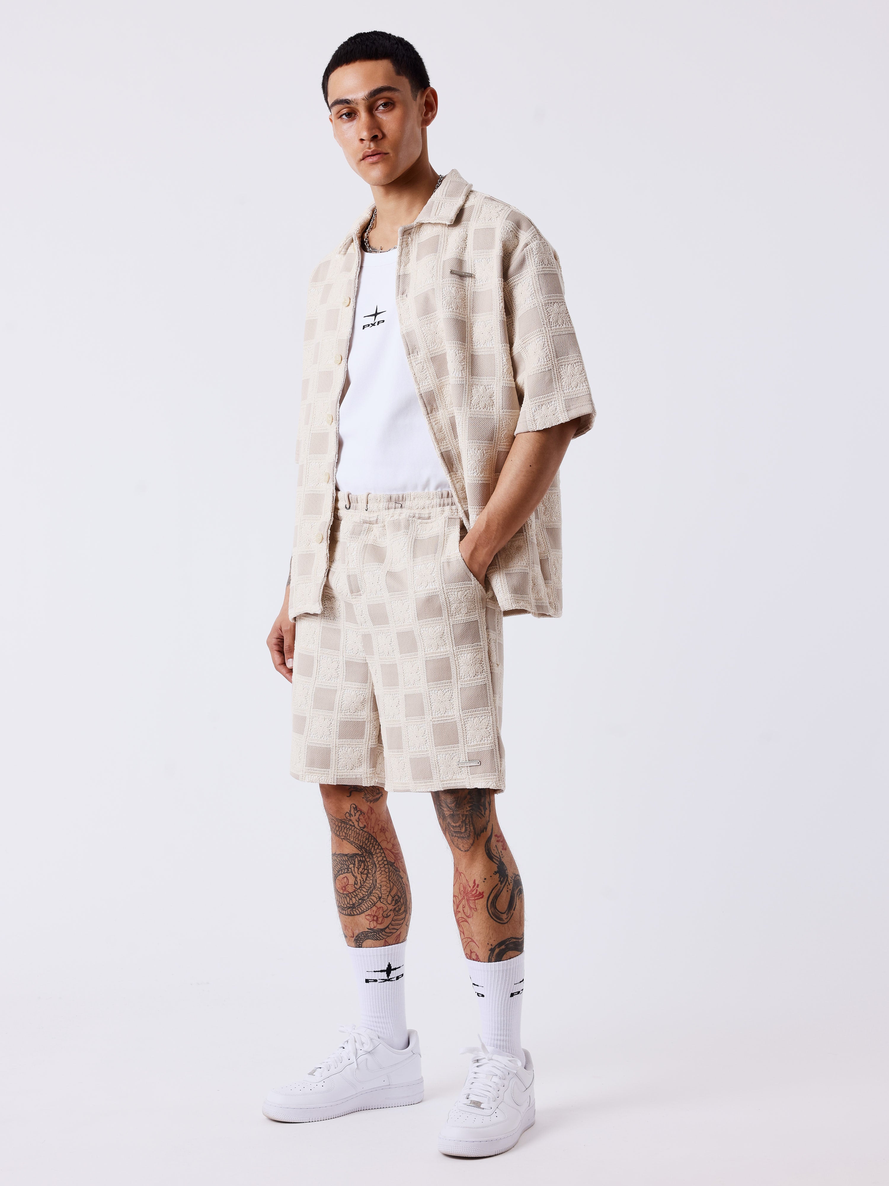 Short homme texturé à motif carreaux-1
