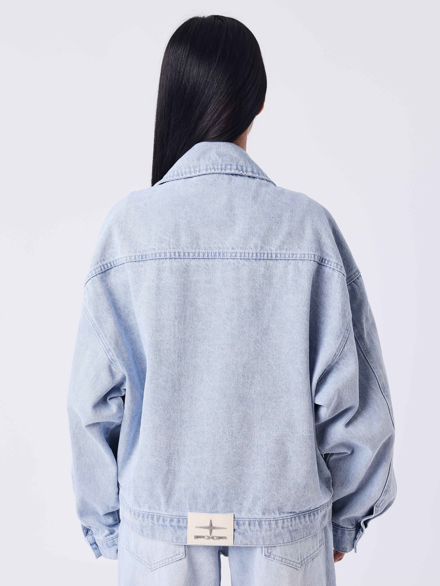 Giacca oversize in denim blu slavato con impunture Polaris