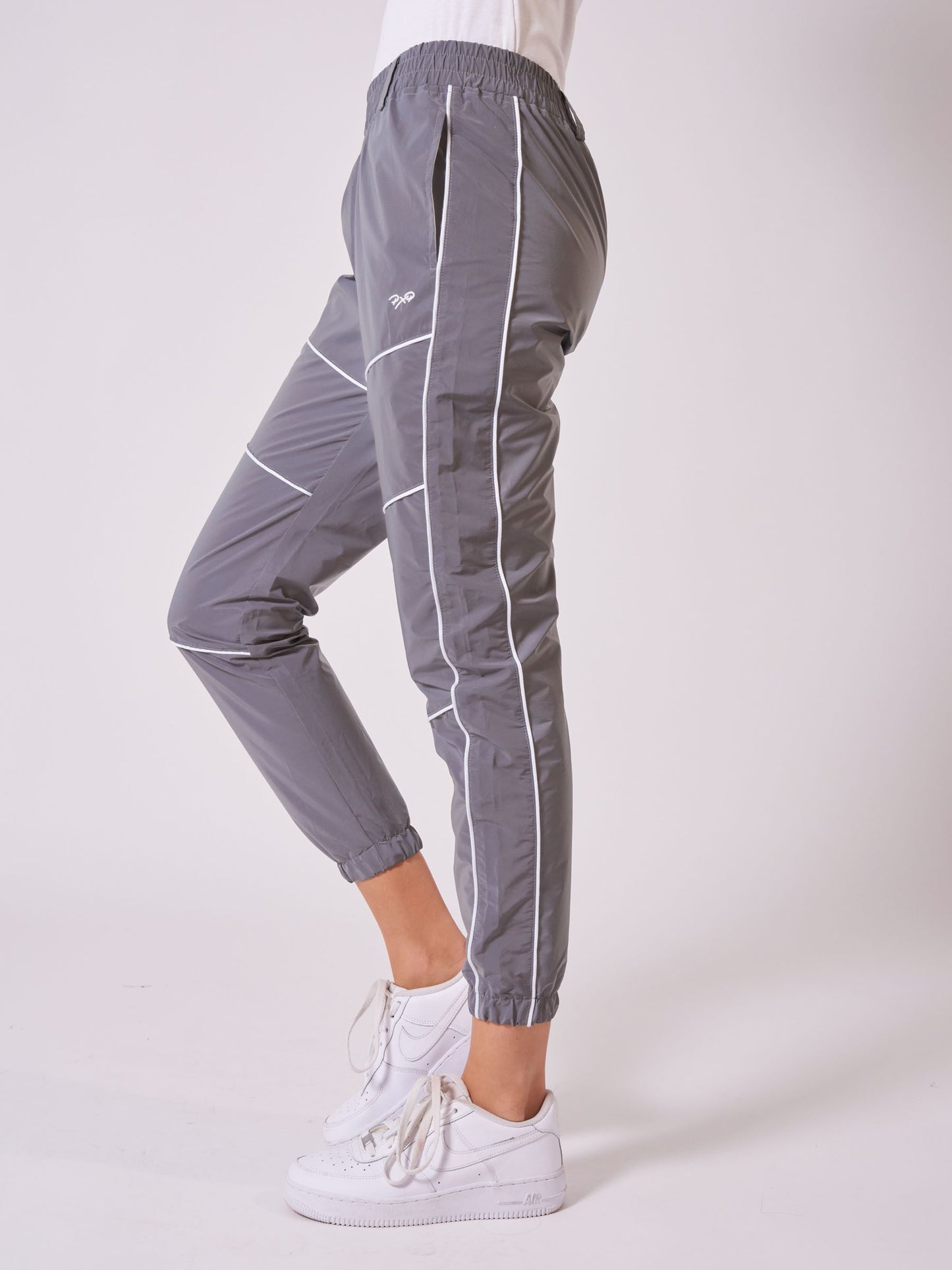 bas-de-jogging-piping-reflechissant