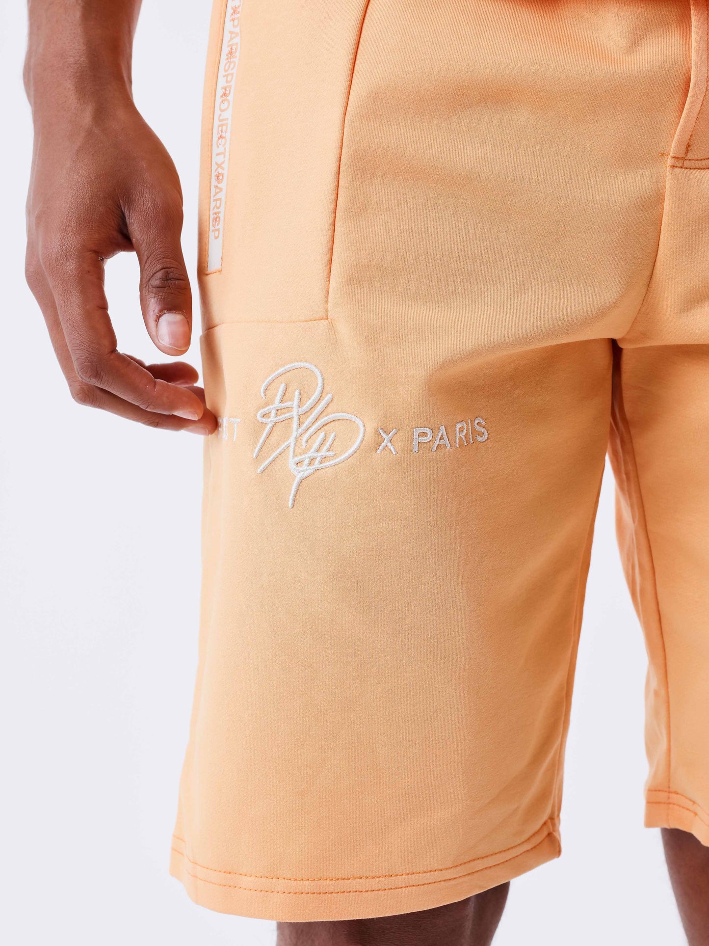 short-uni-avec-bande-logo-apricot-cream