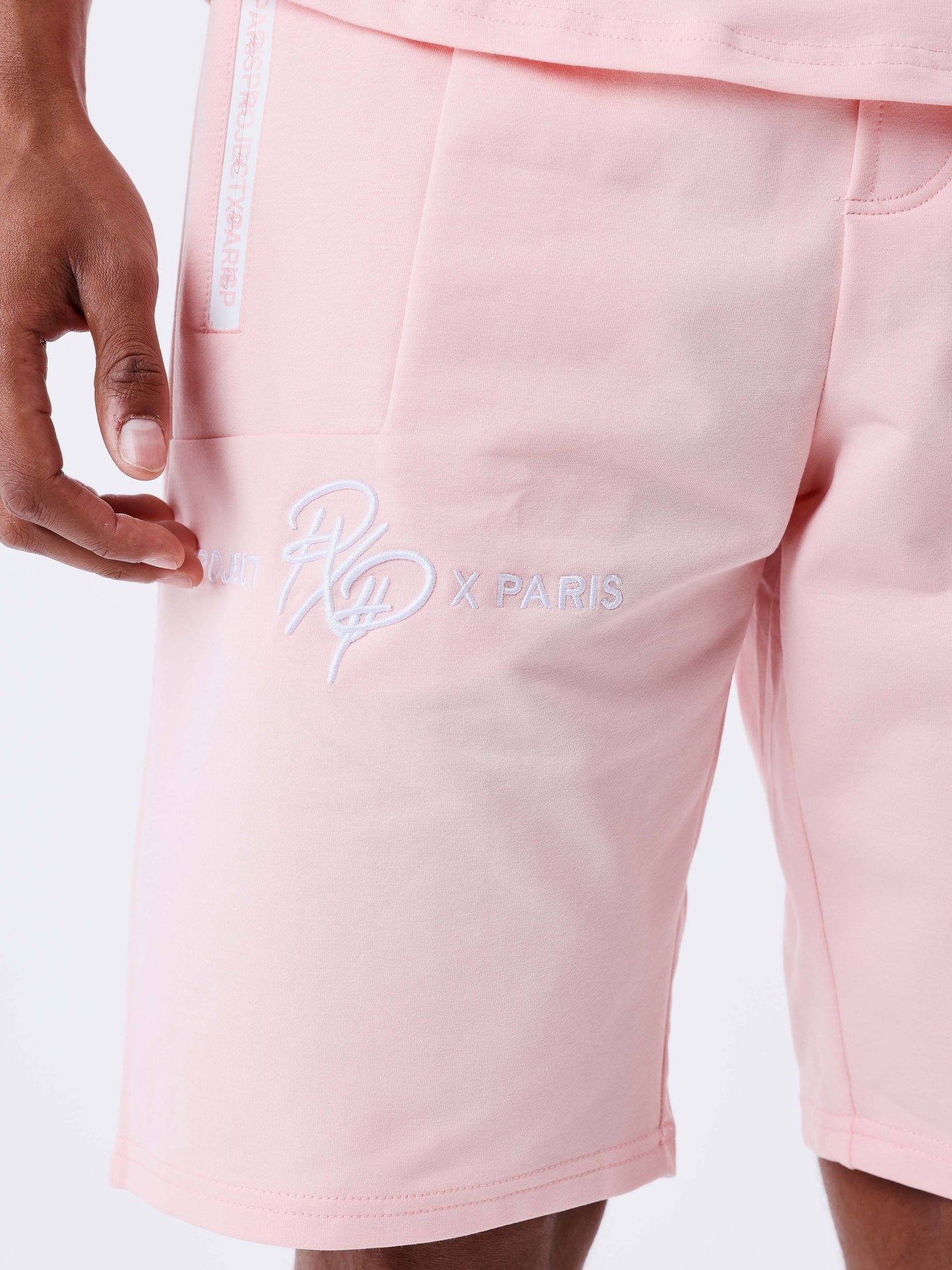 short-uni-avec-bande-logo-rose