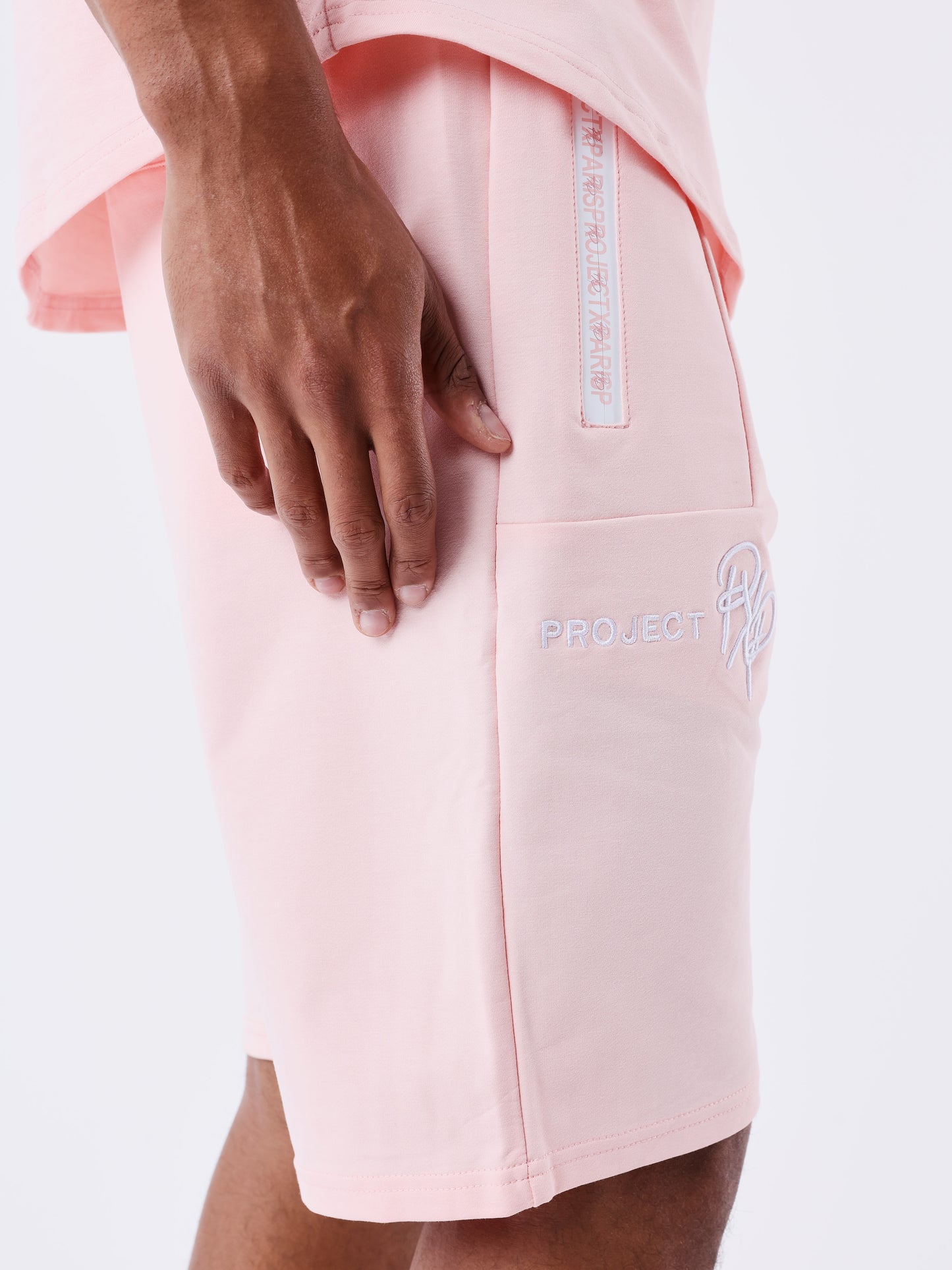 short-uni-avec-bande-logo-rose