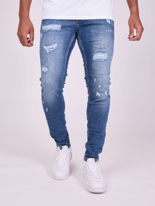 Skinny jeans met versleten...