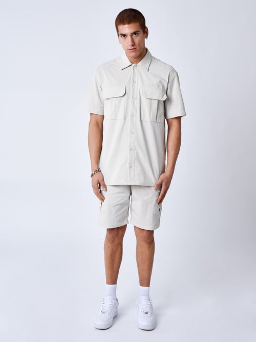 Chemise manches courtes uni...