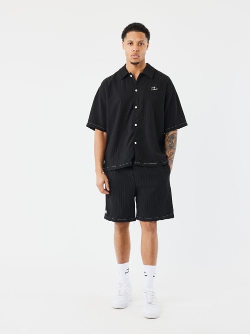 Short casual plisado